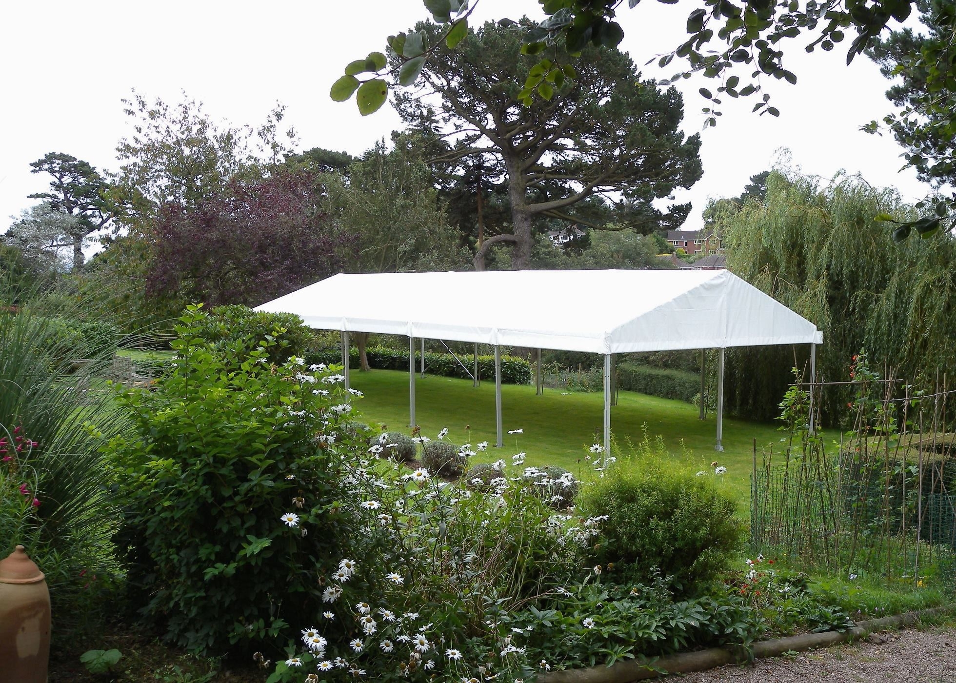 View of 6m x 15m clearspan marquee, roof-only, in garden